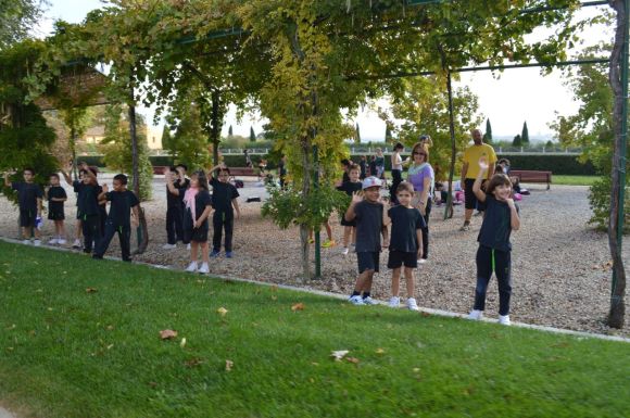 Small children on a field trip at the winery, waving at our tour train.